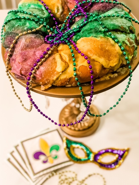 mardi gras king cake and decorations